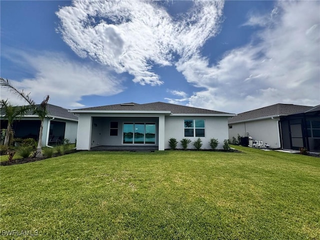 16106 Preservation Blvd, Punta Gorda, FL 33982 - back of property featuring stucco siding and a lawn