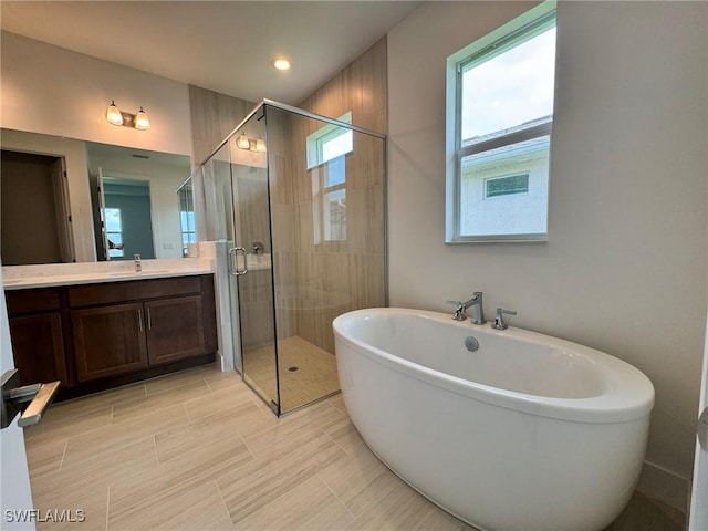 16106 Preservation Blvd, Punta Gorda, FL 33982 - full bathroom with a freestanding tub, a shower stall, vanity, and recessed lighting