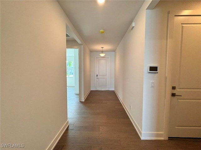 16106 Preservation Blvd, Punta Gorda, FL 33982 - corridor featuring baseboards and dark wood-style flooring
