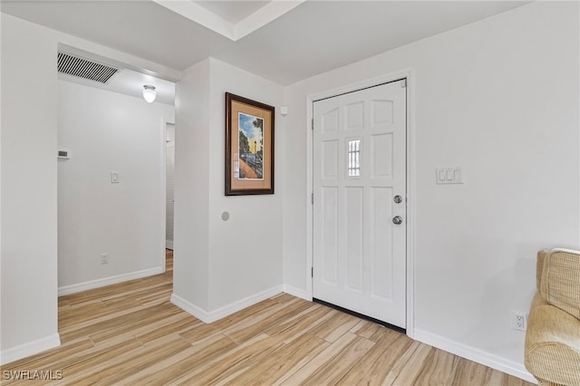 138 Dowling Ave NE, Port Charlotte, FL 33952 - foyer entrance with light wood-style flooring