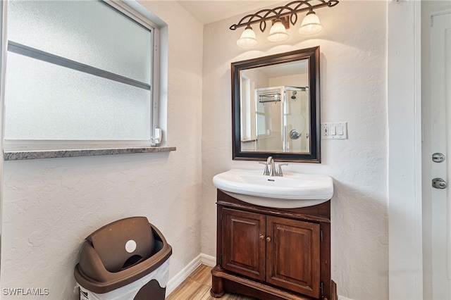 138 Dowling Ave NE, Port Charlotte, FL 33952 - bathroom with vanity and wood finished floors