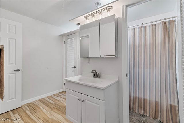 138 Dowling Ave NE, Port Charlotte, FL 33952 - bathroom featuring vanity and wood finished floors