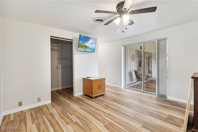 138 Dowling Ave NE, Port Charlotte, FL 33952 - unfurnished bedroom featuring light wood finished floors, access to outside, ceiling fan, and a closet