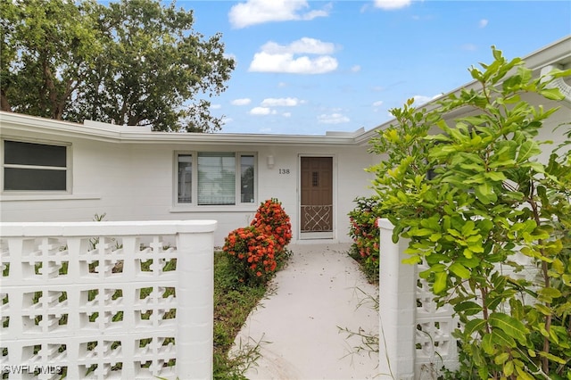 138 Dowling Ave NE, Port Charlotte, FL 33952 - view of front of home featuring a garage