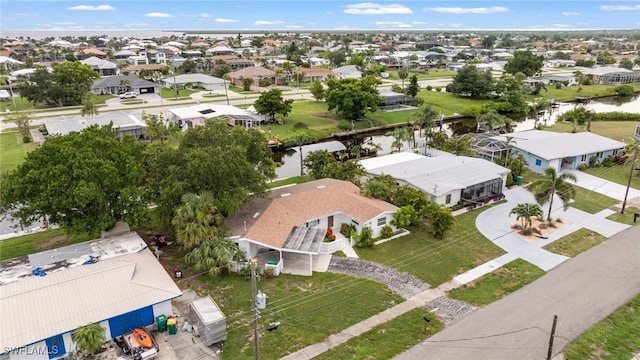 138 Dowling Ave NE, Port Charlotte, FL 33952 - aerial perspective of suburban area featuring a nearby body of water