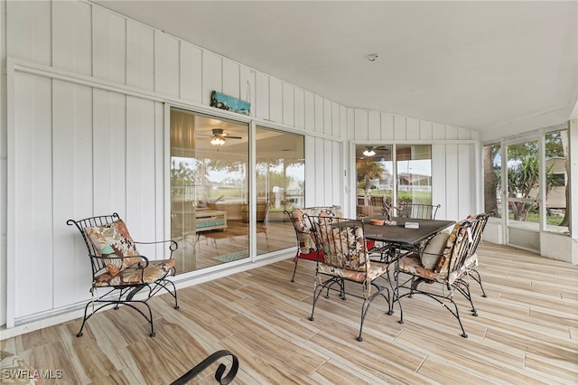138 Dowling Ave NE, Port Charlotte, FL 33952 - sunroom with wood finished floors, outdoor dining space, and ceiling fan