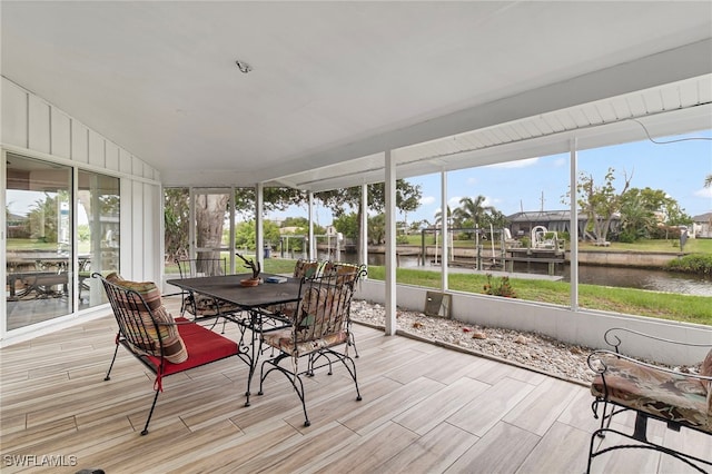 138 Dowling Ave NE, Port Charlotte, FL 33952 - sunroom featuring a water view and outdoor dining space
