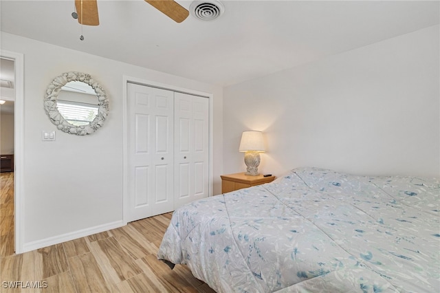 138 Dowling Ave NE, Port Charlotte, FL 33952 - bedroom with wood finished floors, a closet, and a ceiling fan