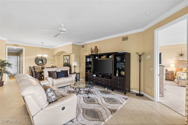 3904 Forest Glen Blvd Unit 102, Naples, FL 34114 - living room featuring light tile patterned flooring, ceiling fan, ornamental molding, arched walkways, and a chandelier
