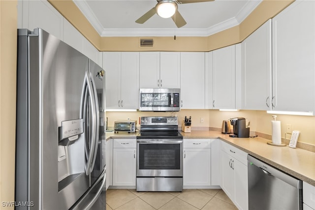 3904 Forest Glen Blvd Unit 102, Naples, FL 34114 - kitchen with stainless steel appliances, crown molding, light countertops, white cabinetry, and ceiling fan