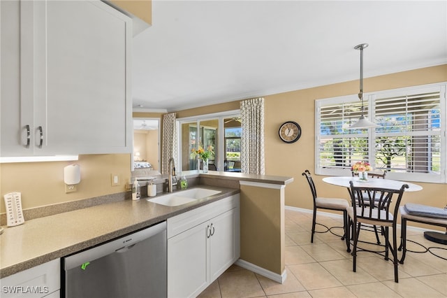 3904 Forest Glen Blvd Unit 102, Naples, FL 34114 - kitchen with dishwasher, white cabinetry, hanging light fixtures, light tile patterned flooring, and a peninsula