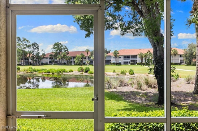 3904 Forest Glen Blvd Unit 102, Naples, FL 34114 - entryway featuring a water view and healthy amount of natural light