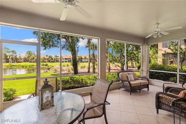 3904 Forest Glen Blvd Unit 102, Naples, FL 34114 - sunroom with ceiling fan, a water view, and a residential view