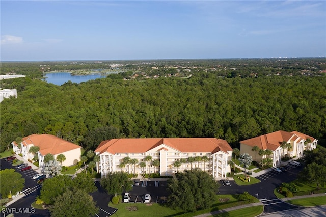 9175 Celeste Dr Unit 305, Naples, FL 34113 - bird's eye view of a forest and a nearby body of water