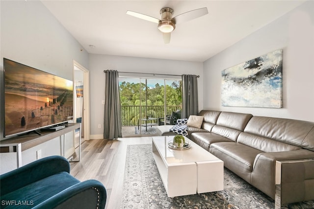 9175 Celeste Dr Unit 305, Naples, FL 34113 - living room featuring wood finished floors and a ceiling fan