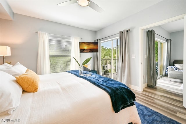 9175 Celeste Dr Unit 305, Naples, FL 34113 - bedroom featuring access to outside, wood finished floors, multiple windows, and a ceiling fan