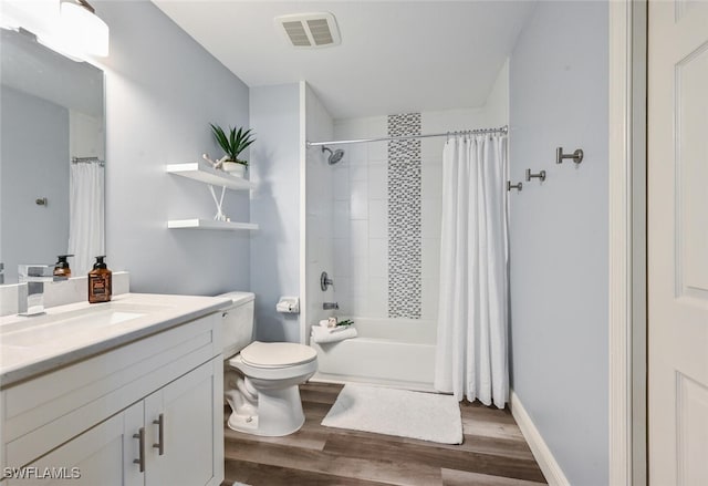 9175 Celeste Dr Unit 305, Naples, FL 34113 - full bath featuring vanity, wood finished floors, and shower / bath combo with shower curtain