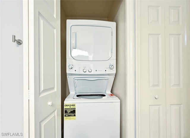 9175 Celeste Dr Unit 305, Naples, FL 34113 - washroom with stacked washing machine and dryer