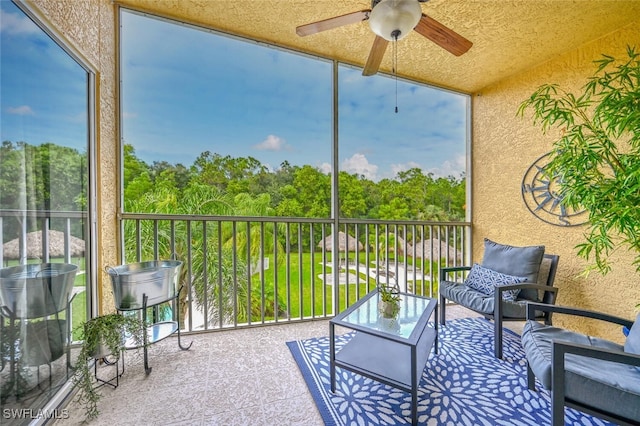9175 Celeste Dr Unit 305, Naples, FL 34113 - sunroom with ceiling fan and healthy amount of natural light