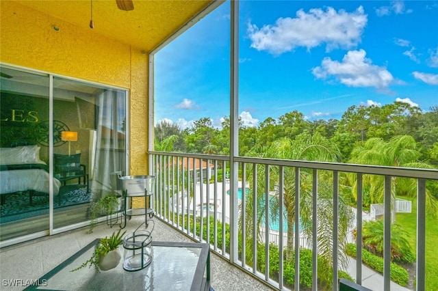 9175 Celeste Dr Unit 305, Naples, FL 34113 - balcony with view of pool and ceiling fan