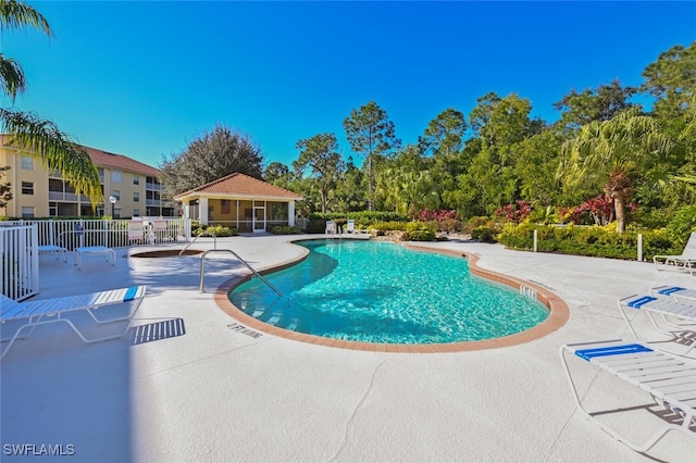 9175 Celeste Dr Unit 305, Naples, FL 34113 - community pool featuring a patio area