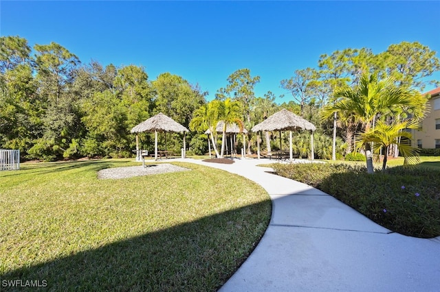 9175 Celeste Dr Unit 305, Naples, FL 34113 - view of community with a gazebo and a yard