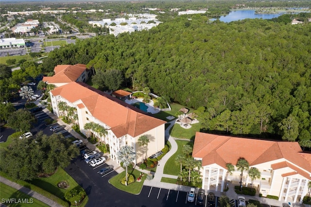 9175 Celeste Dr Unit 305, Naples, FL 34113 - aerial view of a forest and a large body of water