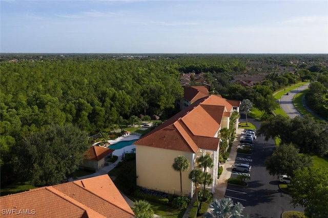 9175 Celeste Dr Unit 305, Naples, FL 34113 - bird's eye view of a heavily wooded area and a pool area