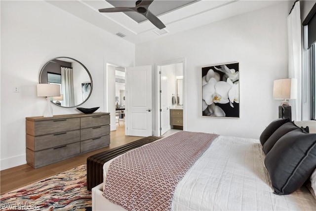 10411 Via Parma Way, Miromar Lakes, FL 33913 - bedroom with light wood-style floors, a ceiling fan, and ensuite bathroom