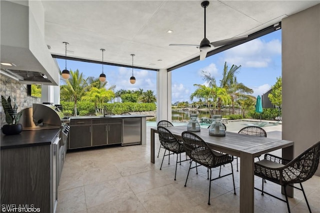 10411 Via Parma Way, Miromar Lakes, FL 33913 - view of patio / terrace with exterior kitchen, ceiling fan, outdoor dining space, and an outdoor pool