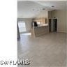 1207 Williams Ave, Lehigh Acres, FL 33972 - view of unfurnished living room