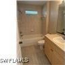 1207 Williams Ave, Lehigh Acres, FL 33972 - bathroom featuring a shower and vanity