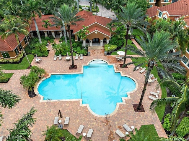 1170 Reserve Way Unit 107, Naples, FL 34105 - community pool with a patio area