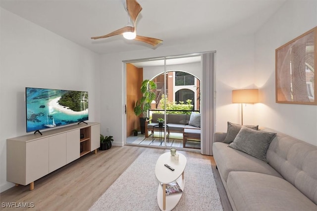 1170 Reserve Way Unit 107, Naples, FL 34105 - living area with light wood-style flooring and ceiling fan