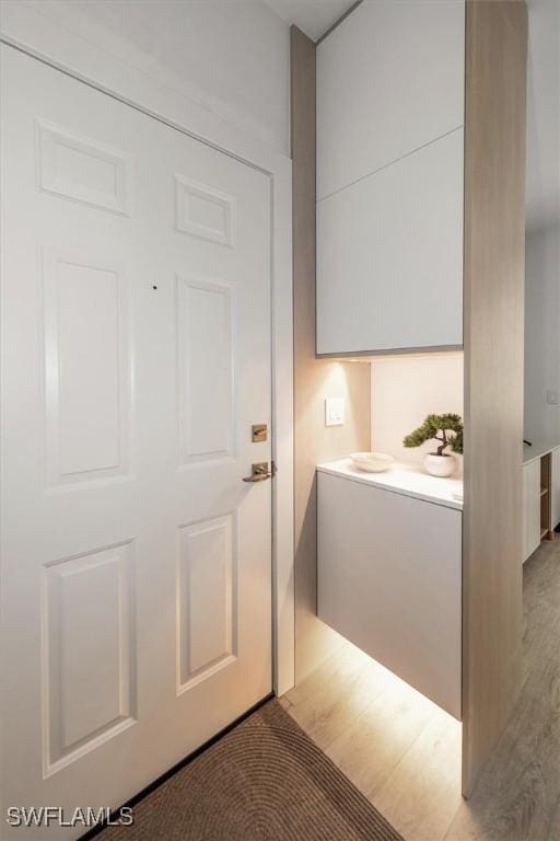 1170 Reserve Way Unit 107, Naples, FL 34105 - interior space featuring light wood finished floors
