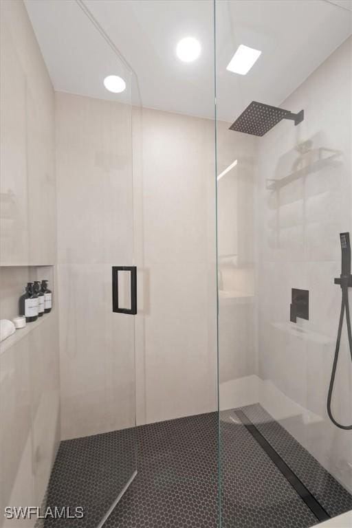 1170 Reserve Way Unit 107, Naples, FL 34105 - bathroom with a shower with shower door and recessed lighting