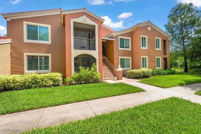 1170 Reserve Way Unit 107, Naples, FL 34105 - view of building exterior with stairs