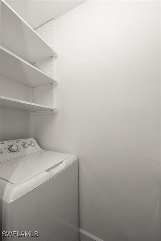 1170 Reserve Way Unit 107, Naples, FL 34105 - laundry area with washer / dryer