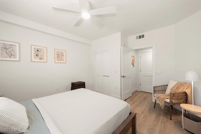 1170 Reserve Way Unit 107, Naples, FL 34105 - bedroom featuring light wood-type flooring and ceiling fan
