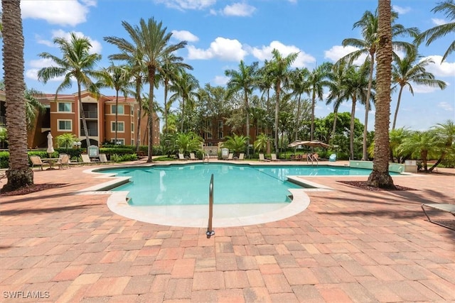 1170 Reserve Way Unit 107, Naples, FL 34105 - community pool with a patio area