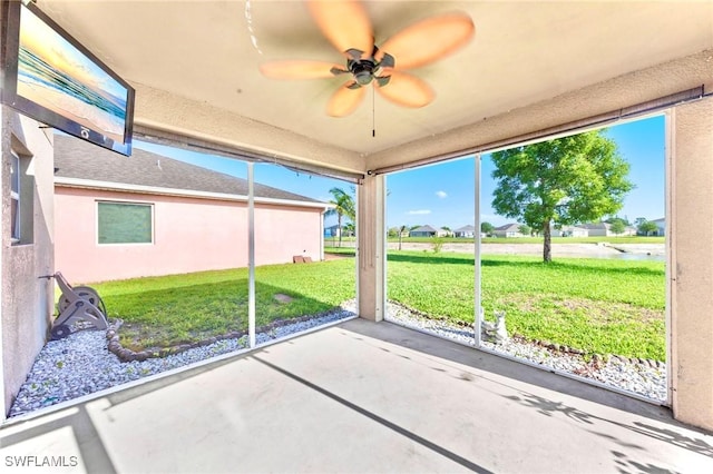 10329 Canal Brook Ln, Lehigh Acres, FL 33936 - unfurnished sunroom with a ceiling fan