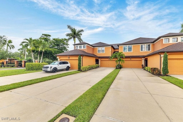 3781 Costa Maya Way Unit 101, Estero, FL 33928 - view of front of home with stucco siding and driveway