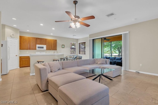 3781 Costa Maya Way Unit 101, Estero, FL 33928 - living area featuring ceiling fan, light tile patterned floors, and recessed lighting