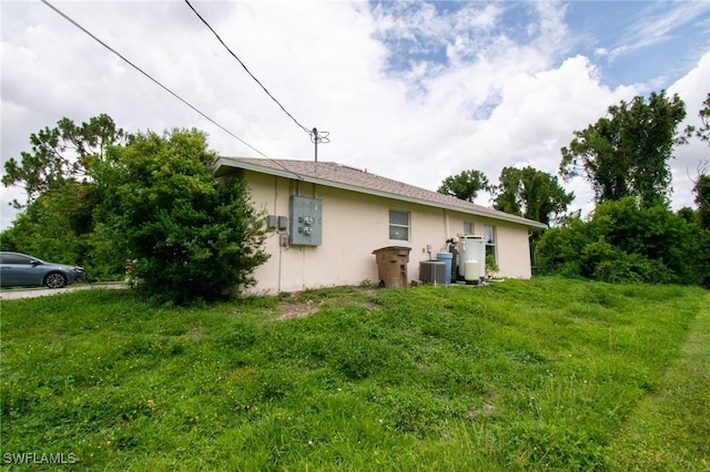 4856/4858 24th St SW, Lehigh Acres, FL 33993 - view of side of home with stucco siding