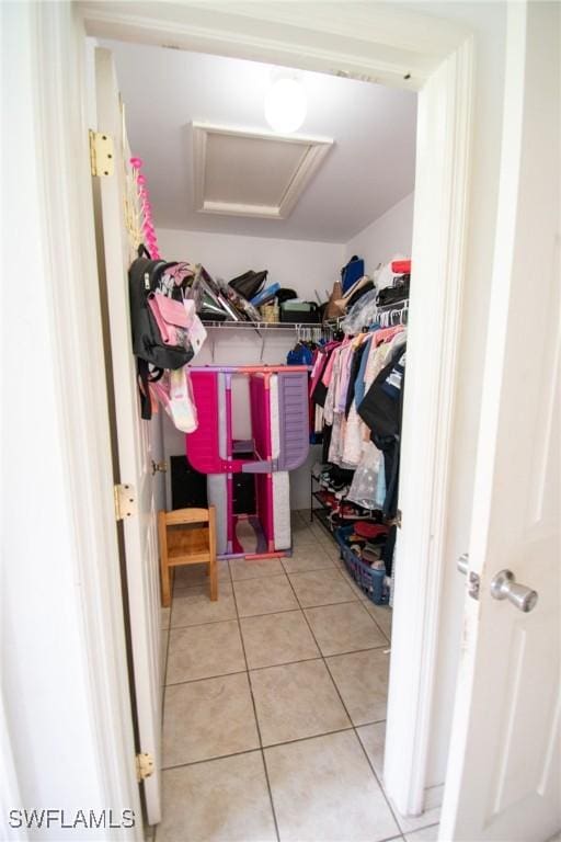 4856/4858 24th St SW, Lehigh Acres, FL 33993 - spacious closet featuring attic access and tile patterned floors
