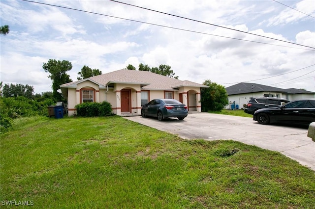 4856/4858 24th St SW, Lehigh Acres, FL 33993 - ranch-style home featuring stucco siding, driveway, and a front yard