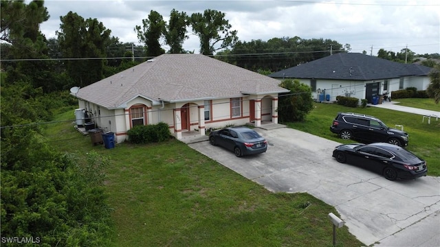 4856/4858 24th St SW, Lehigh Acres, FL 33993 - view of front of house featuring concrete driveway and a front lawn