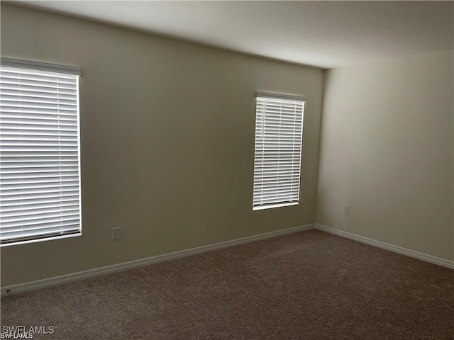 15141 Wildflower Cir, Naples, FL 34119 - spare room featuring carpet and baseboards