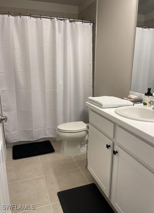 15141 Wildflower Cir, Naples, FL 34119 - bathroom featuring vanity and tile patterned flooring