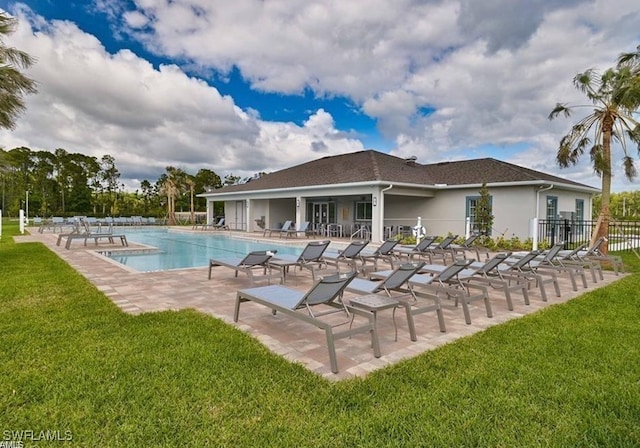 15141 Wildflower Cir, Naples, FL 34119 - community pool with a patio area